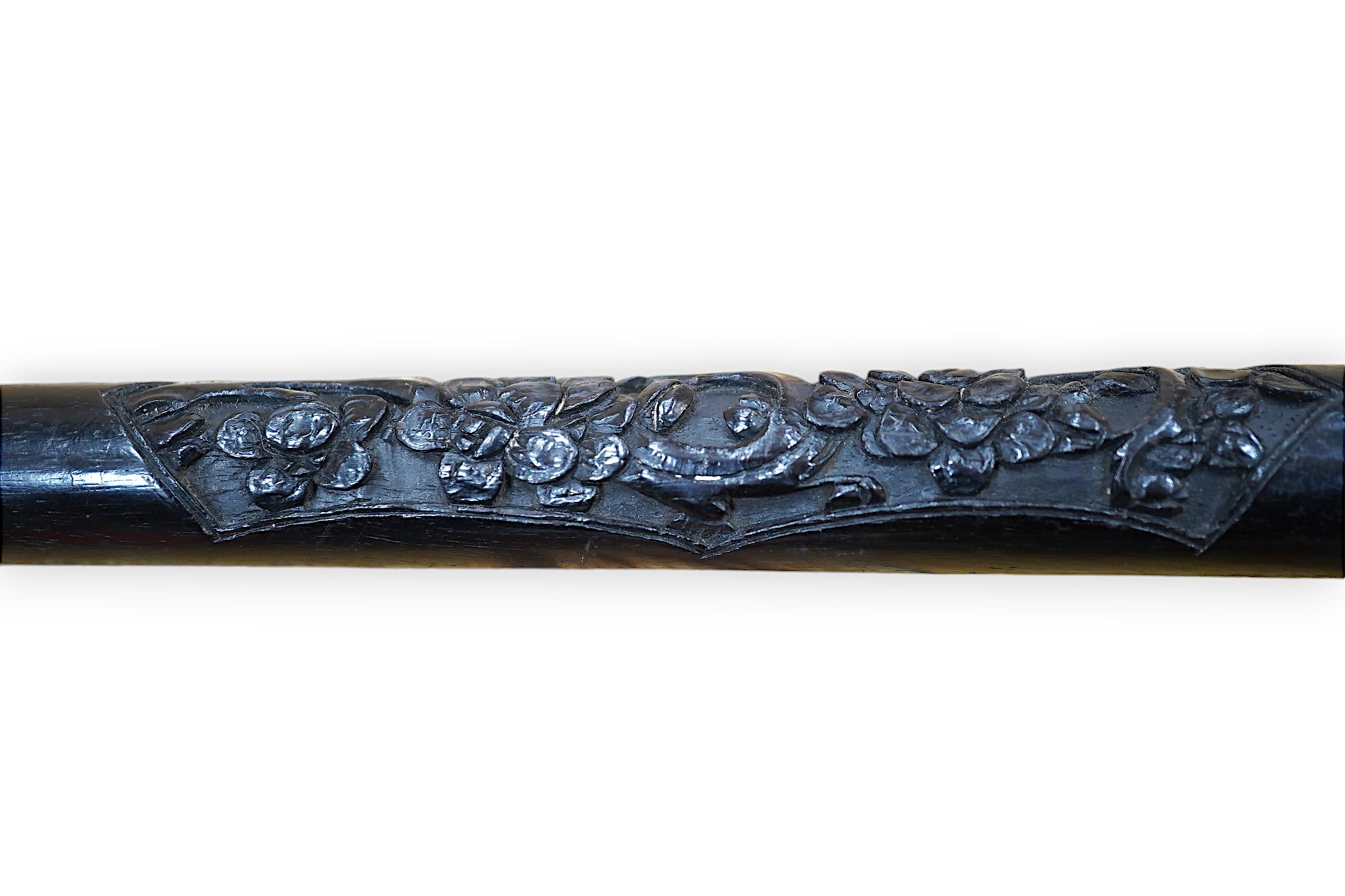 A 19th century Chinese export silver ‘dragon’ handled carved ebony walking cane, handle signed, 81cm long. Condition - fair to good